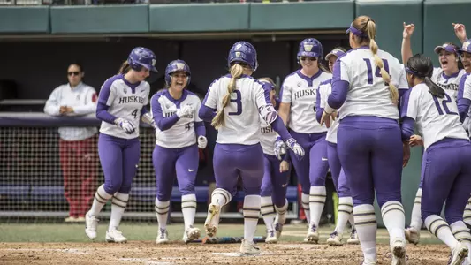 The Huskies celebrate a Taylor Van Zee home run