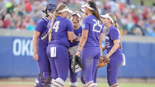 The Huskies gather for a mound conference