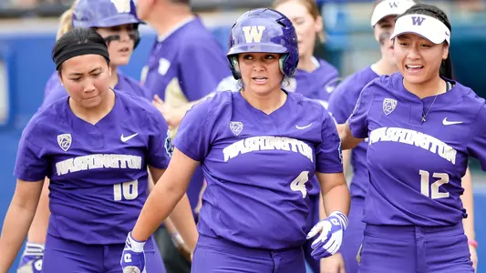 Rachel Ogasawara, Julia DePonte, and Maggie Gallagher celebrate a home run