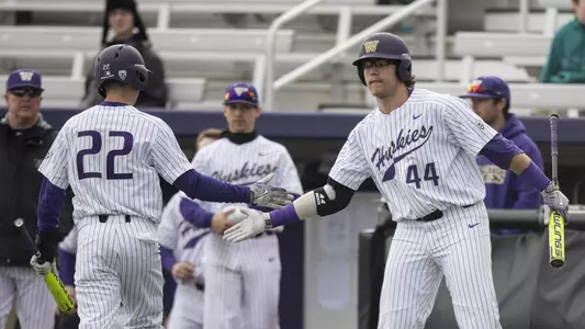 Joe Wainhouse greets Ben Baird after he scores a run.