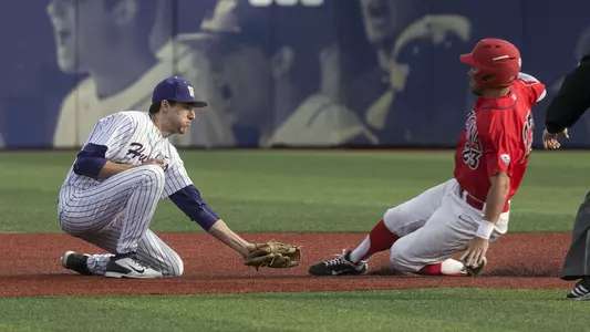 AJ Graffanino provides the tag on an Arizona player.