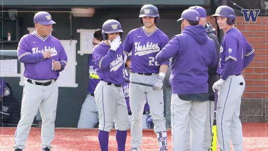 The Huskies share a laugh at Oregon State.