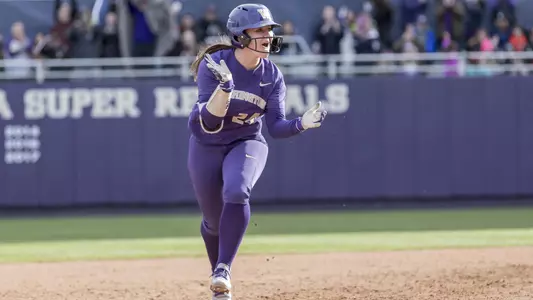 Emma Helm celebrates a home run