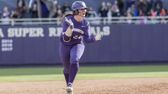 Emma Helm celebrates a home run