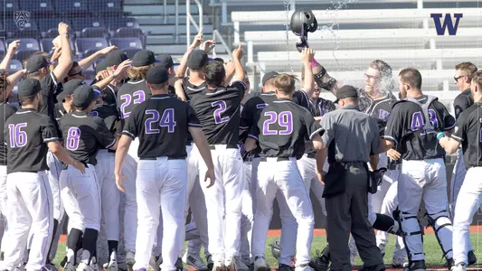 Teammates greet Joe Wainhouse after his walk-off, 2-run HR.