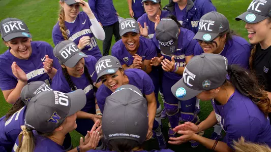 The Huskies celebrate advancing to the WCWS