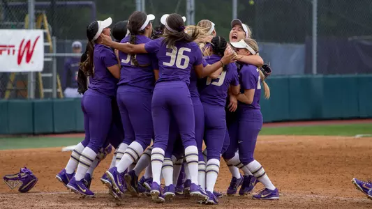 The team huddles and celebrates a win