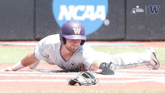 Levi Jordan slides home for the Huskies first run