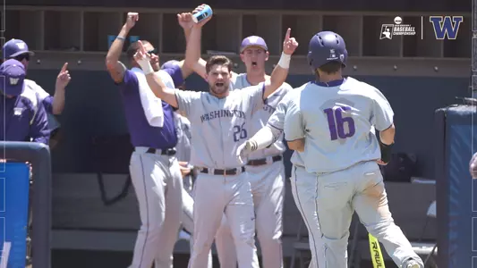 The Huskies celebrate after scoring against Cal State Fullerton.