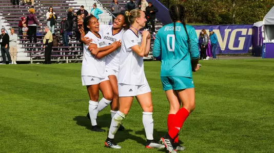 The Huskies hug after a win