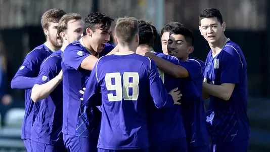Jaret Townsend is congratulated by teammates after scoring Washington's first goal at Georgetown in the NCAA Quarterfinals