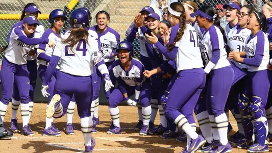 Emma Helm celebrates a homerun