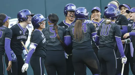 The Huskies celebrate two runs