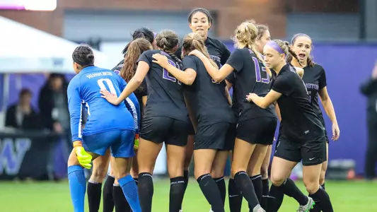 The Huskies break huddle before a game