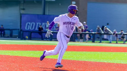 Rollie Nichols had a 3-run triple in the eighth inning to rally the Huskies.