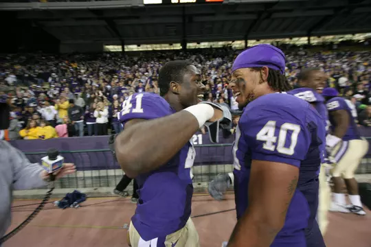 2009 University of Washington football vs. Arizona at Husky Stadium. Mason Foster celebrates victory with Victor Aiyewa