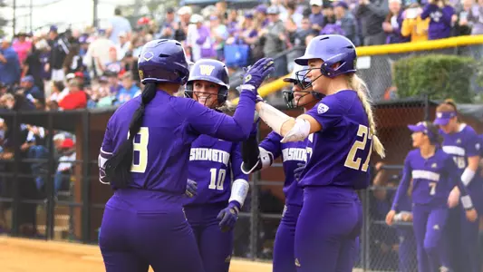The team high fives after a home run