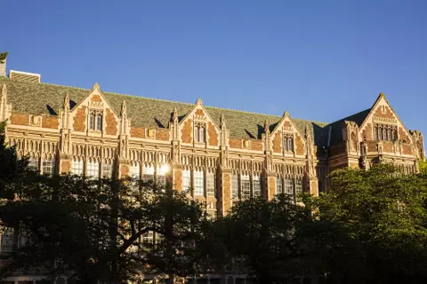 Student graduates celebrate with photos on the UW Seattle campus
