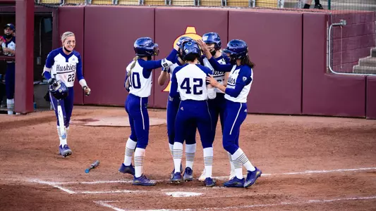 The team celebrates Jadelyn Allchin's grand slam