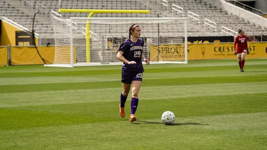 Mary Johnston dribbles up field