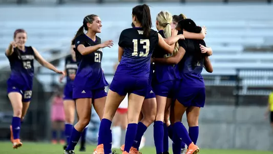 The team gathers to celebrate a goal