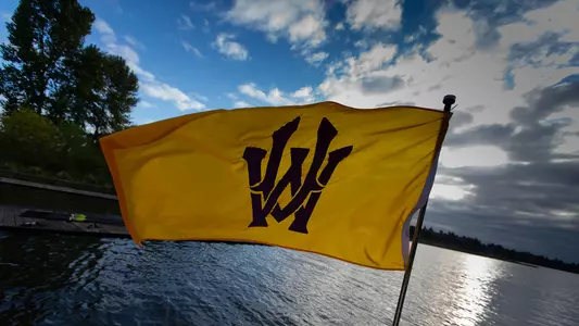UW rowing team flag on a boat