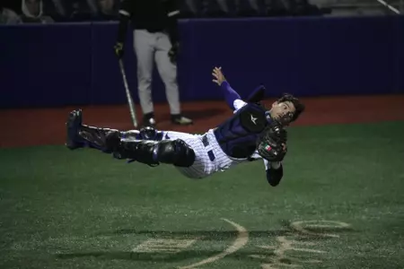 Catcher Johnny Tincher Lays Out Backwards To Make The Catch