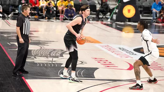 Paul Mulcahy hold the ball against SDSU in Continental Tire Main Event