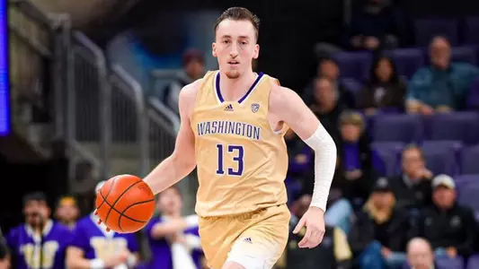 Moses Wood dribbles up the court against EWU