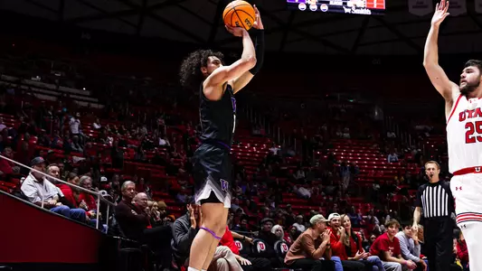 Nate Calmese shoots a three-pointer at Utah