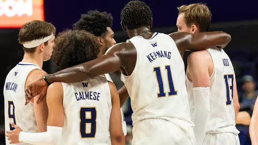 Franck Kepnang with his arms around Nate Calmese, Moses Wood and Paul Mulcahy