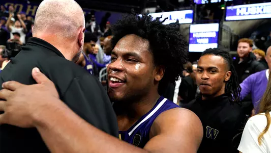 Sahvir Wheeler hugs coach on court after win over No. 7 Gonzaga