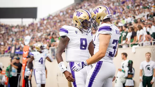 Michael Penix Jr. and Jack Westover celebrate at Michigan State