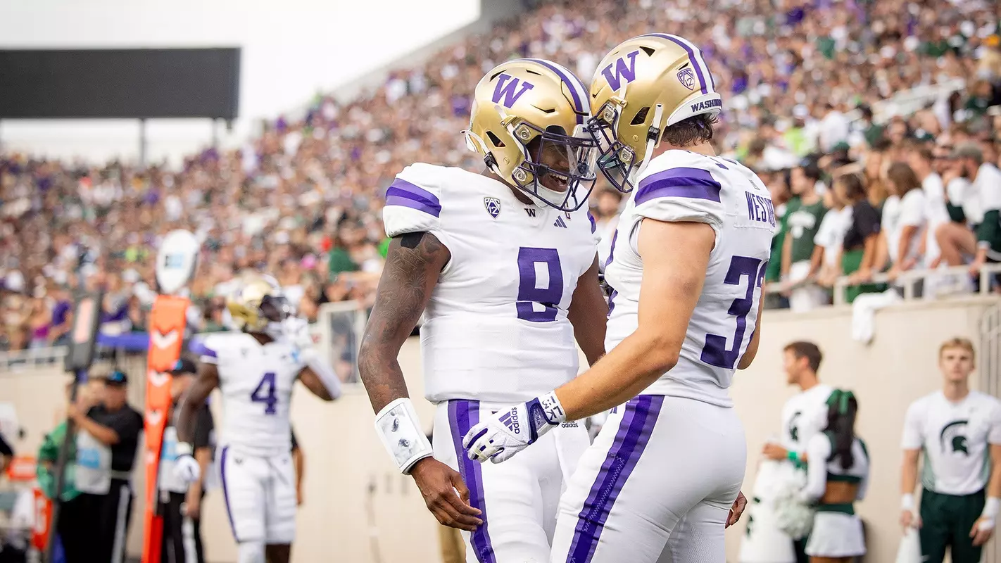 Michael Penix Jr. and Jack Westover celebrate at Michigan State