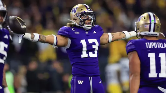Kamren Fabiculanan celebrates after INT against Michigan
