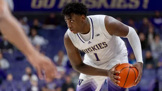 Great Osobor holds the basketball against UC Davis