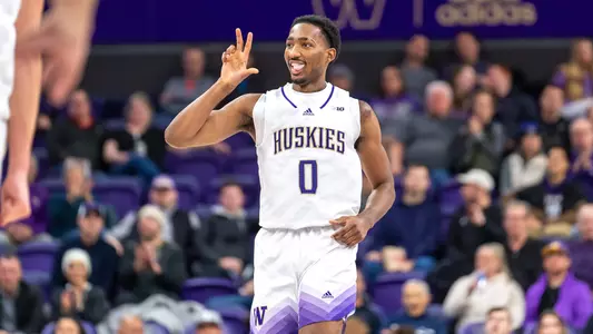 Mekhi Mason sticking tongue out and holding up three fingers against EWU