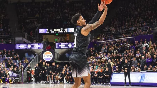 DJ Davis shoots a three in front of a packed crowd at Alaska Airlines Arena