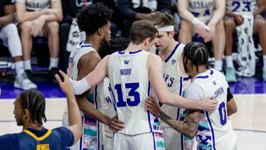 UW men's basketball huddles against Cal in Create Your Purpose adidas jerseys