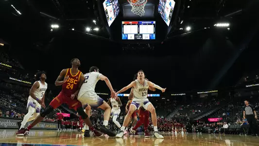 Moses Wood and Wilhelm Breidenbach box out USC in Pac-12 Tournament