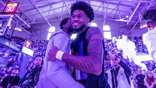 Keion Brooks Jr. smiles while being announced pregame