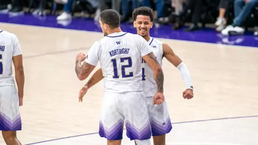 DJ Davis chest bumps Luis Kortright against Maryland