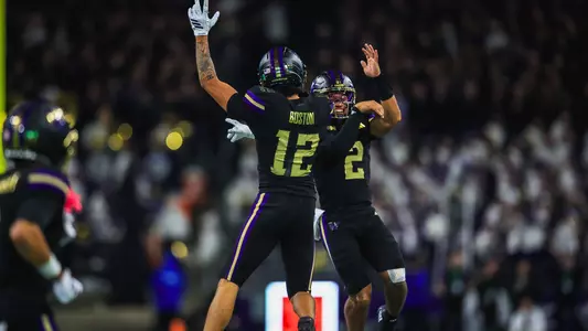 Denzel Boston and Demond Williams Jr. celebrate a touchdown against Rutgers