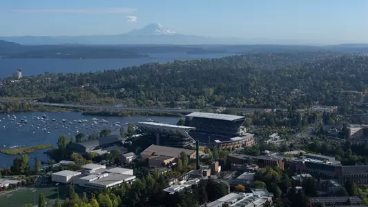 helicopter photo of Alaska Airlines Field at Husky Stadium with Mount Rainier in background