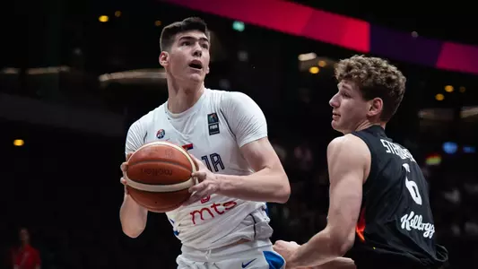 Nikola Dzepina posts up Hannes Steinbach during the 2025 FIBA U19 World Cup