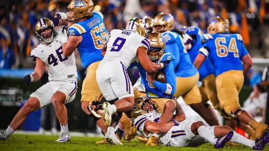Jacob Manu and Makell Esteen tackle UCLA player