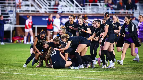 Dawg pile celebration after the penalty shootout victory to reach the NCAA Elite Eight