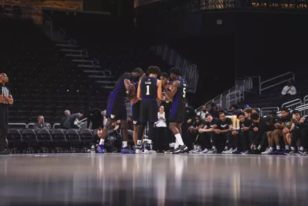 UW Men's Basketball huddle vs Colorado at Acrisure Classic