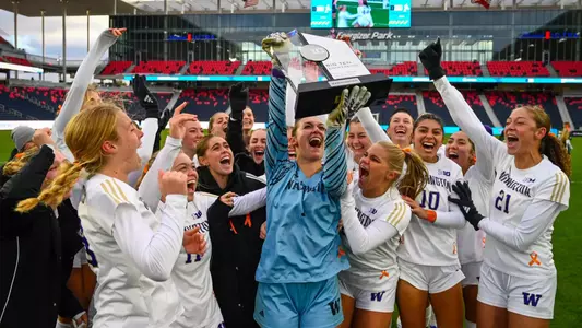 Tanner Ijams lifts the trophy after UW's 4-1 penalty shootout win to secure the 2025 Big Ten Tournament Championship