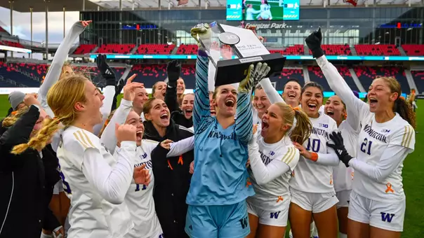 Tanner Ijams lifts the trophy after UW's 4-1 penalty shootout win to secure the 2025 Big Ten Tournament Championship